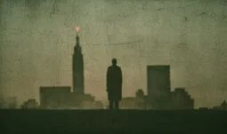 silhouette of a man looking at Manhattan 