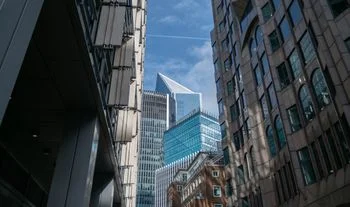 An electronic trading firm cut headcount and raised pay to £535k in London