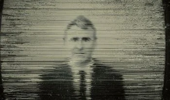 Ken Griffin on a blurred TV 