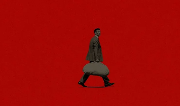 banker carrying a bag of money against a red background